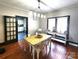 Charming dining room with hardwood floors, modern lighting, and views into the kitchen at 402 Madison St, Lincolnton, NC 28092