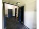 Hallway with dark-painted trim and a tile floor at 402 Madison St, Lincolnton, NC 28092