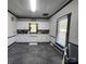 Clean kitchen with white cabinets, dark flooring, and natural light at 402 Madison St, Lincolnton, NC 28092