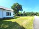 Spacious, flat side yard with well-maintained grass, perfect for outdoor activities and landscaping at 402 Madison St, Lincolnton, NC 28092