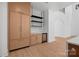 Elegant bar area with custom cabinetry, wine fridge and contemporary shelving at 4208 Antioch Church Rd # 1, Weddington, NC 28104