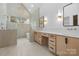 Modern bathroom featuring dual vanities, stylish mirrors, and a luxurious stone accent wall at 4208 Antioch Church Rd # 1, Weddington, NC 28104