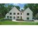 Modern two-story home featuring a white exterior, black framed windows, manicured landscaping, and a charming front entrance at 4208 Antioch Church Rd # 1, Weddington, NC 28104