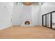 Bright, airy living room with fireplace, wood floors, and expansive windows at 4208 Antioch Church Rd # 1, Weddington, NC 28104