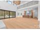Open-concept living space featuring a modern kitchen and large windows overlooking backyard at 4208 Antioch Church Rd # 1, Weddington, NC 28104