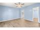 Bedroom with a ceiling fan, laminate flooring and an ensuite bathroom at 4351 Saluda Rd, Rock Hill, SC 29730