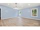 Dining room with a chandelier, laminate flooring and windows at 4351 Saluda Rd, Rock Hill, SC 29730