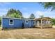 Side exterior view of a blue house featuring a covered deck and spacious yard at 4351 Saluda Rd, Rock Hill, SC 29730