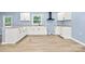 Charming kitchen with white cabinets, granite countertops, and modern black vent hood at 4351 Saluda Rd, Rock Hill, SC 29730