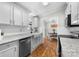 Well-lit kitchen with stainless steel appliances and white subway tile backsplash at 4534 Pebblebrook Sw Cir, Concord, NC 28027