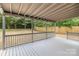 Cozy back porch with string lights overlooking the backyard at 5234 Bellflower Ln, Charlotte, NC 28227