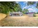 The backyard features a covered patio, a storage shed, and a new fence at 5234 Bellflower Ln, Charlotte, NC 28227