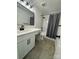 Modern bathroom featuring elegant vanity, black hardware, and sleek finishes at 5234 Bellflower Ln, Charlotte, NC 28227
