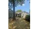 Charming single-story home with a well-maintained front yard and mature tree at 5234 Bellflower Ln, Charlotte, NC 28227