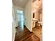 Hallway view to bedroom and bathroom with wood and tile flooring at 5234 Bellflower Ln, Charlotte, NC 28227