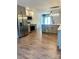 Bright kitchen features modern stainless steel appliances and gray cabinetry at 5234 Bellflower Ln, Charlotte, NC 28227