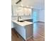 Modern kitchen featuring an island with a sink and stylish lighting at 5234 Bellflower Ln, Charlotte, NC 28227