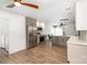 Modern kitchen featuring stainless steel appliances, wooden floors, and gray-and-white cabinetry at 5234 Bellflower Ln, Charlotte, NC 28227