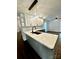Kitchen island featuring pendant lighting, stylish backsplash, and open floor plan at 5234 Bellflower Ln, Charlotte, NC 28227