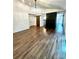 Inviting living room with hardwood floors, a fireplace, and stylish light fixture at 5234 Bellflower Ln, Charlotte, NC 28227