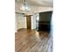 Spacious living room featuring hardwood floors, a fireplace, and a barn door at 5234 Bellflower Ln, Charlotte, NC 28227