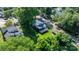 Aerial view of the property showcasing its location, deck, garage, and surrounding greenery at 704 N Main Ave, Newton, NC 28658