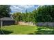 Spacious backyard with lush greenery and a wooden fence, perfect for outdoor activities at 704 N Main Ave, Newton, NC 28658