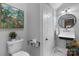 A charming powder room with a unique sink, elegant mirror, and decorative accents at 704 N Main Ave, Newton, NC 28658