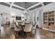 Stylish dining room featuring a coffered ceiling, hardwood floors, and elegant furnishings at 704 N Main Ave, Newton, NC 28658