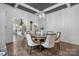 Bright dining room featuring a coffered ceiling, hardwood floors, and stylish furnishings at 704 N Main Ave, Newton, NC 28658