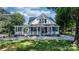 Charming two-story home with a welcoming front porch and beautifully landscaped yard at 704 N Main Ave, Newton, NC 28658