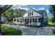 Charming two-story home with a welcoming front porch and well-maintained landscaping at 704 N Main Ave, Newton, NC 28658