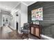 Charming hallway with wood floors, dark accent wall, and elegant decor at 704 N Main Ave, Newton, NC 28658