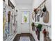 Hallway featuring rustic decorations, wood plank walls, and view to the exterior through the front door at 704 N Main Ave, Newton, NC 28658