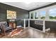 A bright hallway boasts dark wood accent walls, white trim, and eye-catching artwork at 704 N Main Ave, Newton, NC 28658