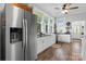 Charming kitchen featuring white cabinets, granite countertops, stainless steel appliances, and window views at 704 N Main Ave, Newton, NC 28658