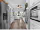 Modern kitchen featuring stainless steel appliances, white cabinets, and ample counter space at 704 N Main Ave, Newton, NC 28658