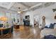 Elegant living room with hardwood floors, fireplace, and seamless transition to the dining area at 704 N Main Ave, Newton, NC 28658