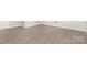 Finished basement features vinyl plank flooring and painted trim at 7154 Woodcock Trl, Stanley, NC 28164