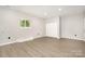 Finished basement features modern flooring, recessed lighting, and closet space at 7154 Woodcock Trl, Stanley, NC 28164