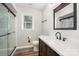 Updated bathroom features a new vanity, modern fixtures, and a sleek glass enclosed shower at 7154 Woodcock Trl, Stanley, NC 28164