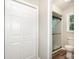 Bathroom featuring tiled shower with glass door and closet at 7154 Woodcock Trl, Stanley, NC 28164