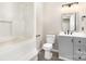 Full bathroom with tub and shower, updated vanity, and modern fixtures at 7154 Woodcock Trl, Stanley, NC 28164