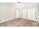 Bedroom featuring neutral walls, carpet, and closet space at 7154 Woodcock Trl, Stanley, NC 28164