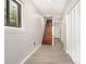 Hallway with stairs showcasing new flooring and ample closet space at 7154 Woodcock Trl, Stanley, NC 28164