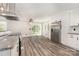 Spacious eat-in kitchen featuring stainless steel appliances and laminate flooring at 7154 Woodcock Trl, Stanley, NC 28164