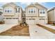 Inviting townhome with a one car garage and well-manicured front yard and concrete driveway at 7217 Hodges Meadow Ln, Charlotte, NC 28213
