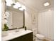 Bright bathroom featuring a modern vanity, stylish mirror, and coordinated fixtures at 80 Sumner Nw Ave, Concord, NC 28027
