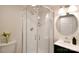 Bathroom showcasing glass-enclosed shower, modern vanity with black cabinets, and neutral color scheme at 80 Sumner Nw Ave, Concord, NC 28027