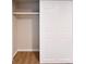 This is a closet with light hardwood floors, white walls, and a closet with sliding doors at 80 Sumner Nw Ave, Concord, NC 28027